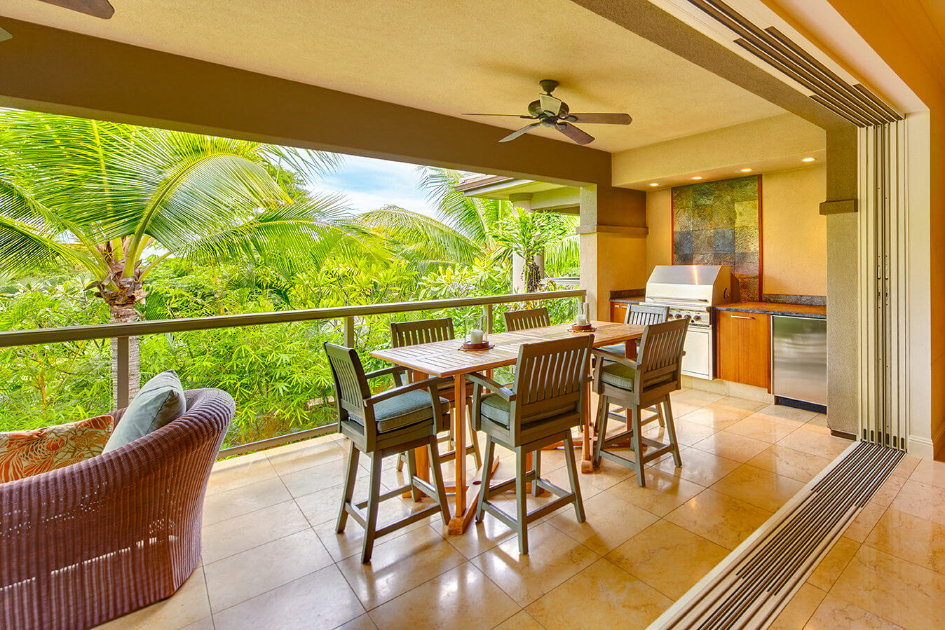 living room seating area in Ho'olei Villas with full wall of windows give view of outside