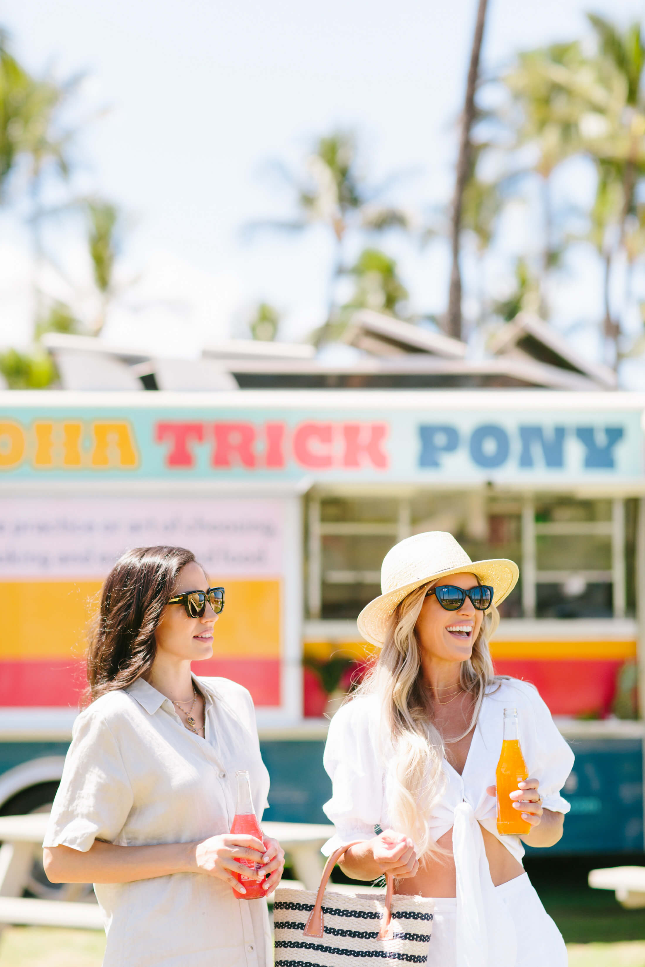 two women stand in front of the Aloha Trick Pony food truck