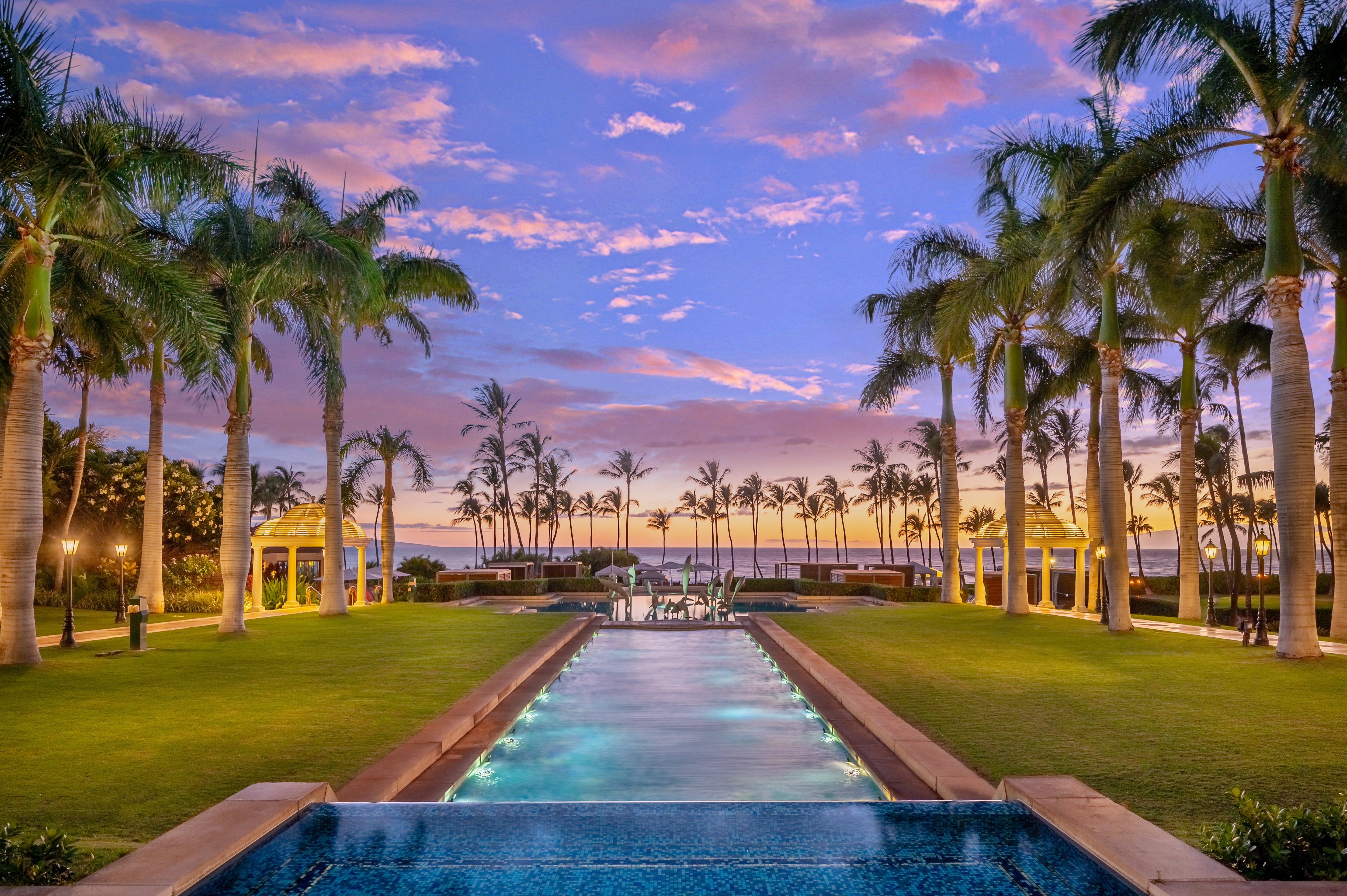 water feature stretches out into the grounds of Grand Wailea resort with lines of palm tress on either side