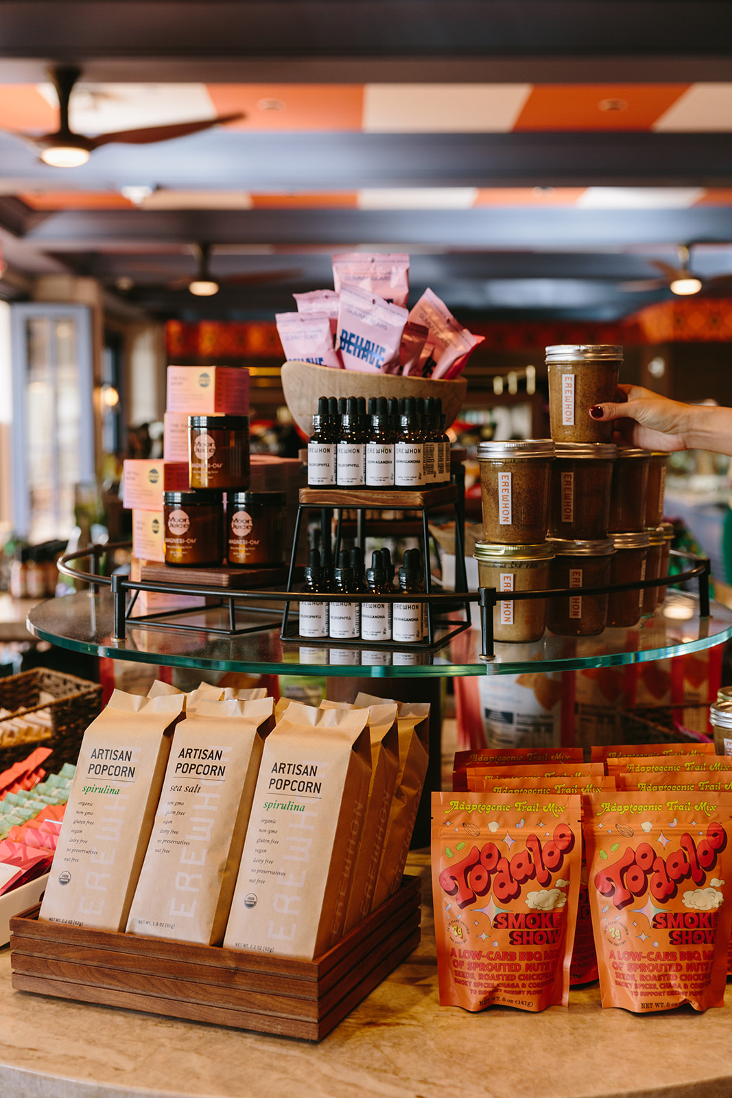Erewhon products such as Artisan popcorn, Nut Butters, Elixirs and vitamin C packets inside of Loulu within the Grand Wailea