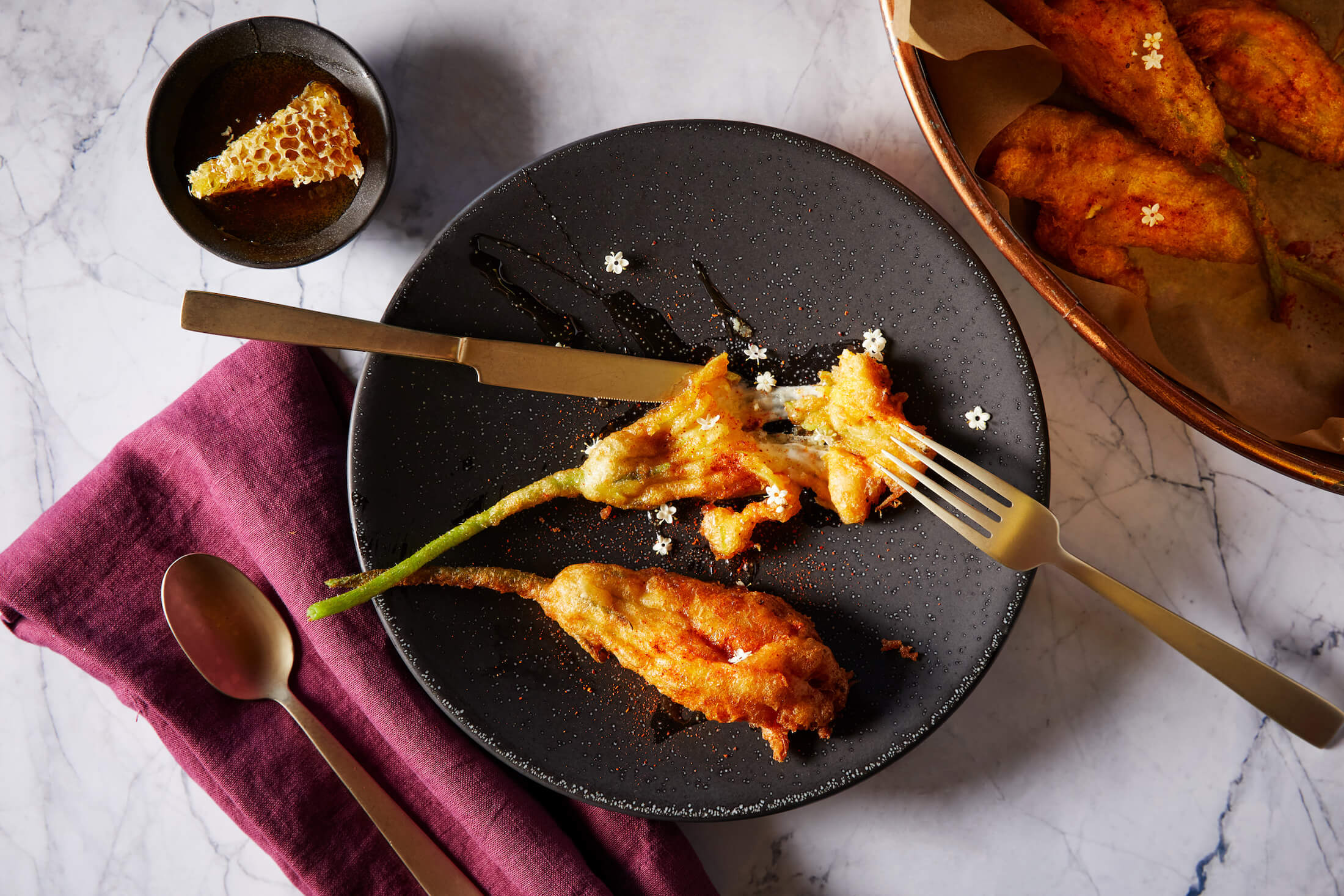 squash blossom on black plate