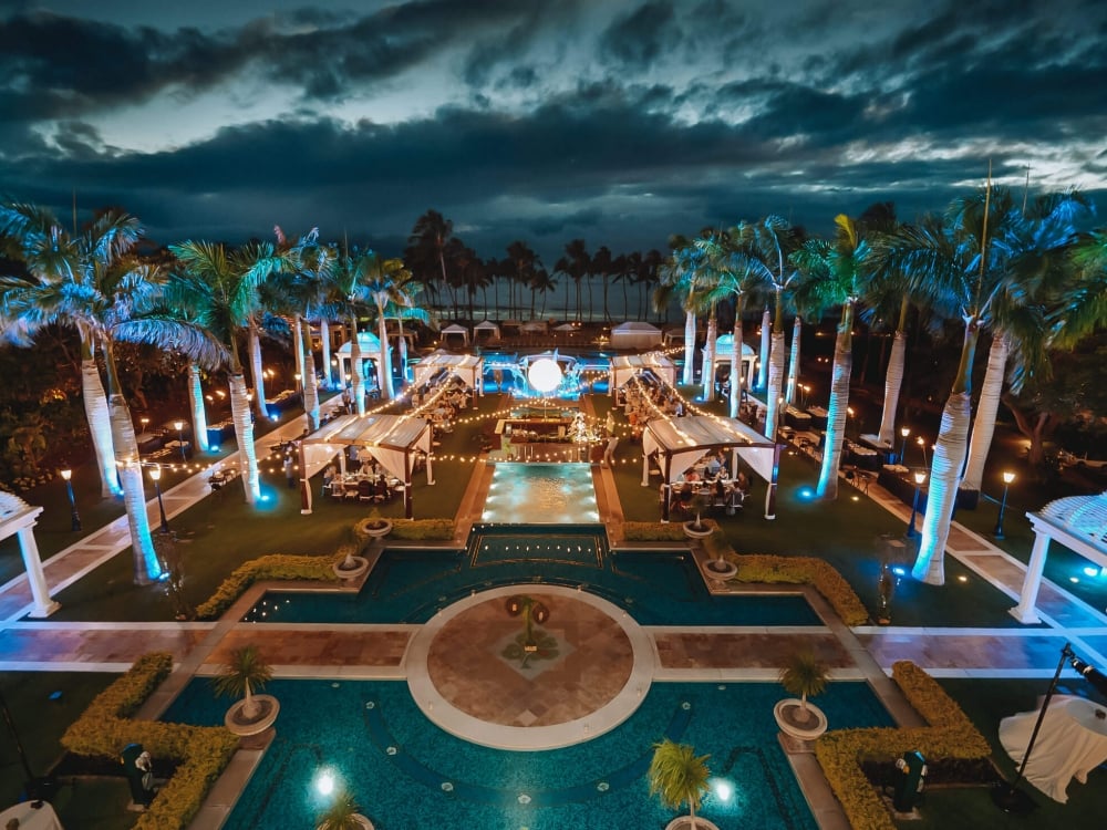 view of the Grand Wailea resort and pool with a dark blue and orange sky