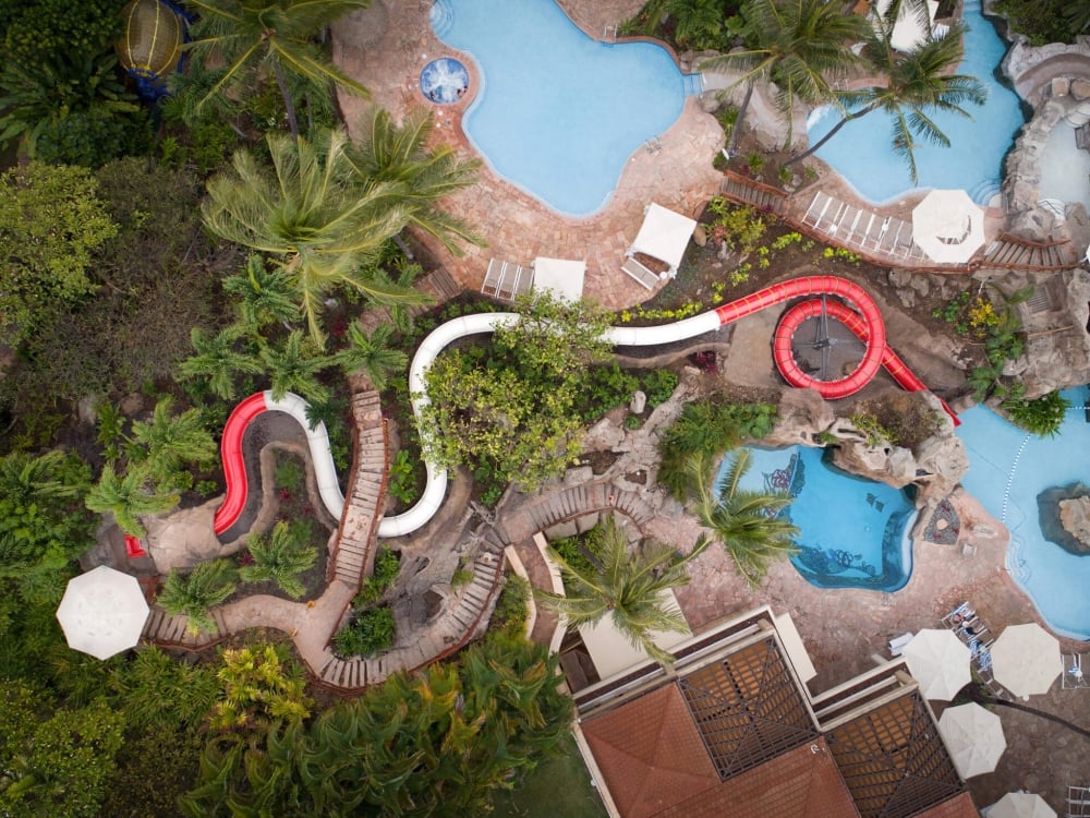 aerial view of the red and white lava tube at Grand Wailea's activity canyon park