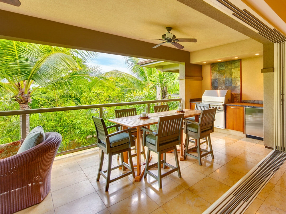living room seating area in Ho'olei Villas with full wall of windows give view of outside
