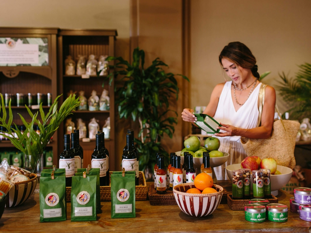 a woman shops inside Cafe Kula storefront