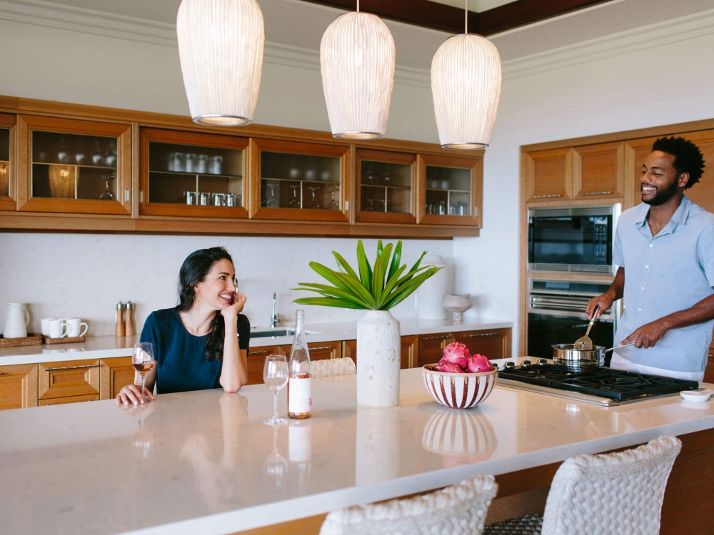 two people gather around island seating area