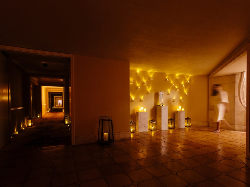 wall of candles flicker inside the spa