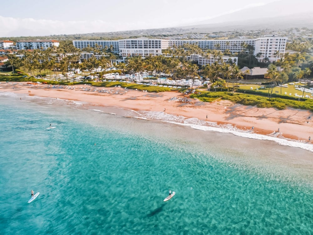 aerial view of the ocean, beach, and island of Maui