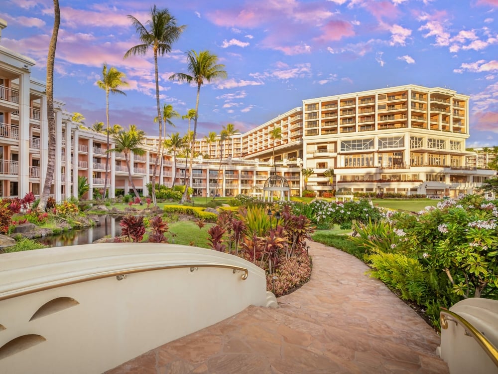 a bridge walkway on the grounds of the Grand Wailea resort