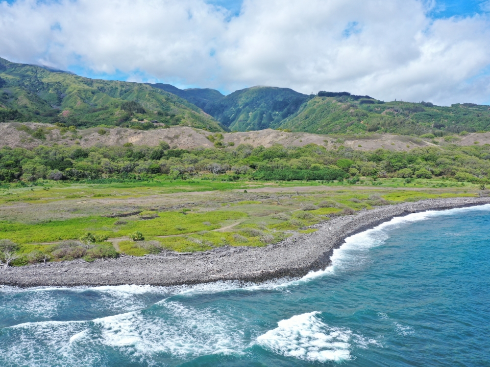 view of ocean with mountains in the background