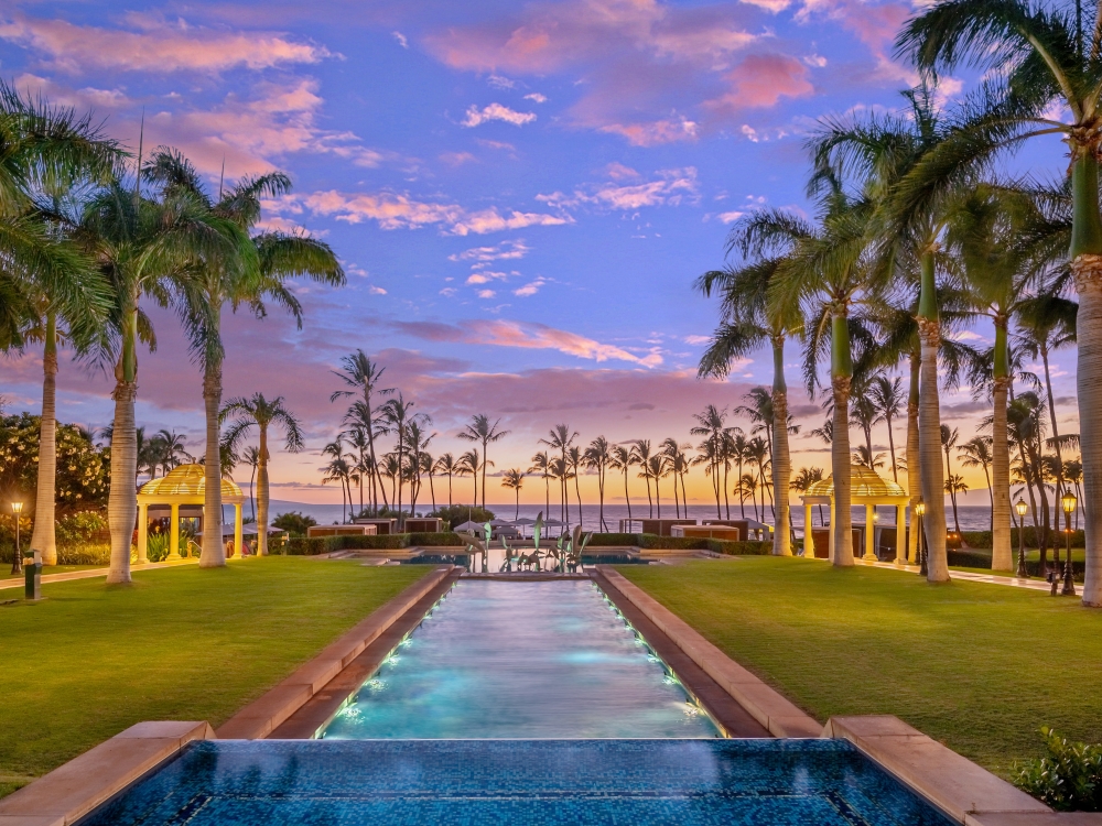 water feature stretches out into the grounds of Grand Wailea resort with lines of palm tress on either side