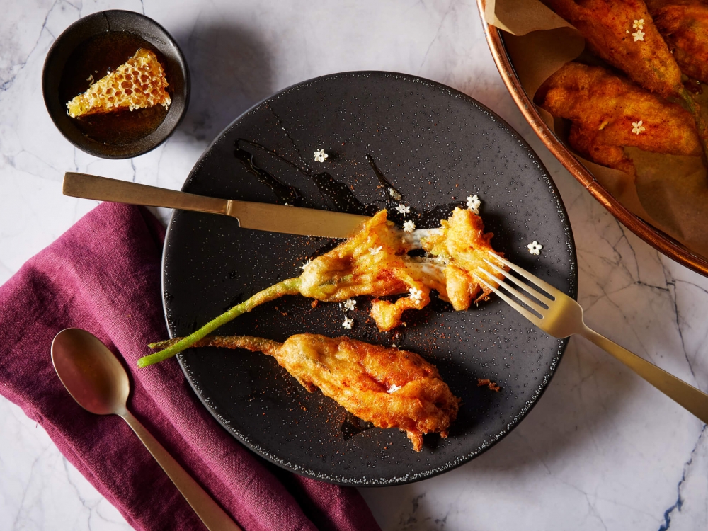 squash blossom on black plate