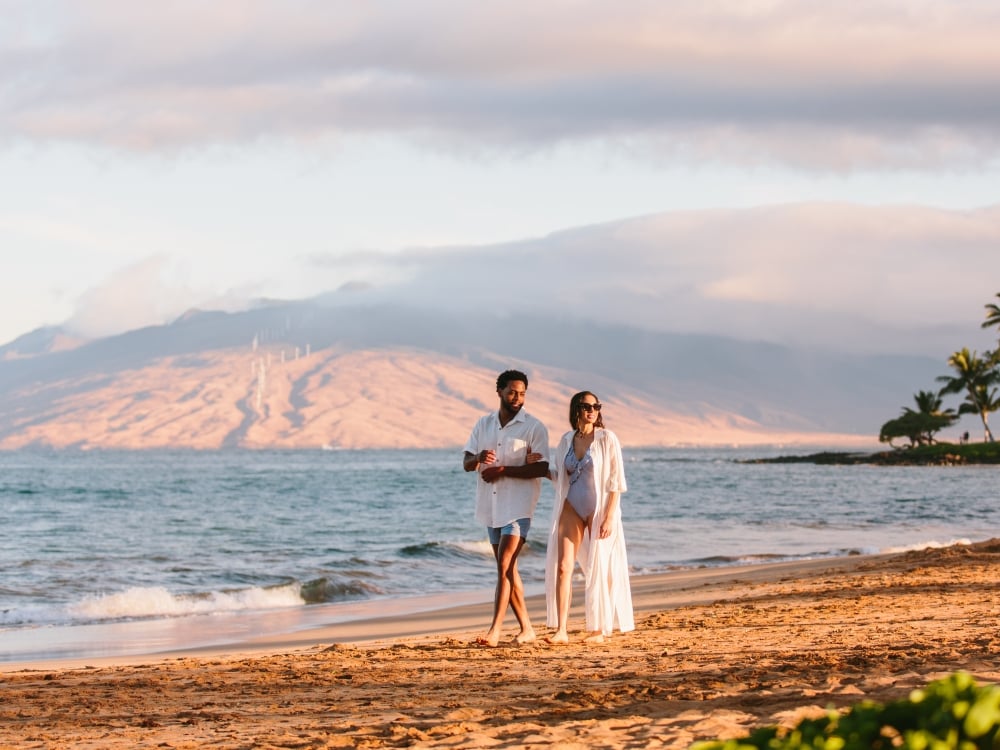 couple walking on beach melia