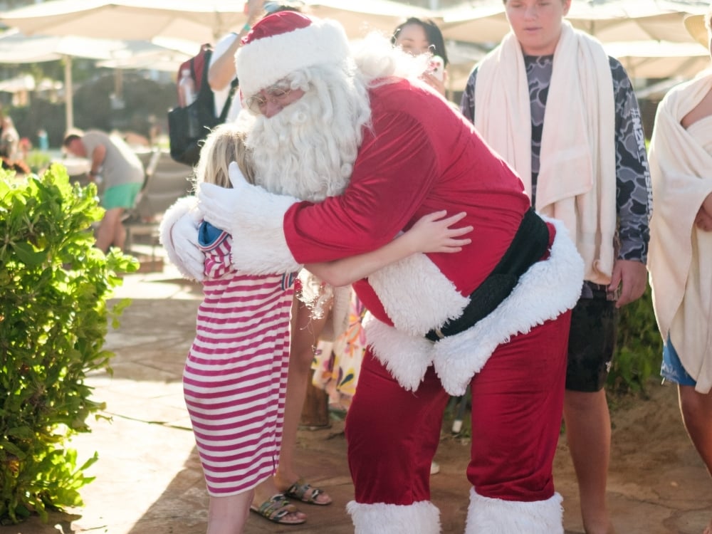 santa hugging girl