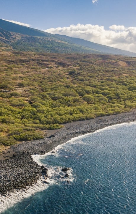 view of ocean with mountains in the background