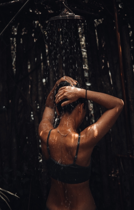 Woman in waterfall.