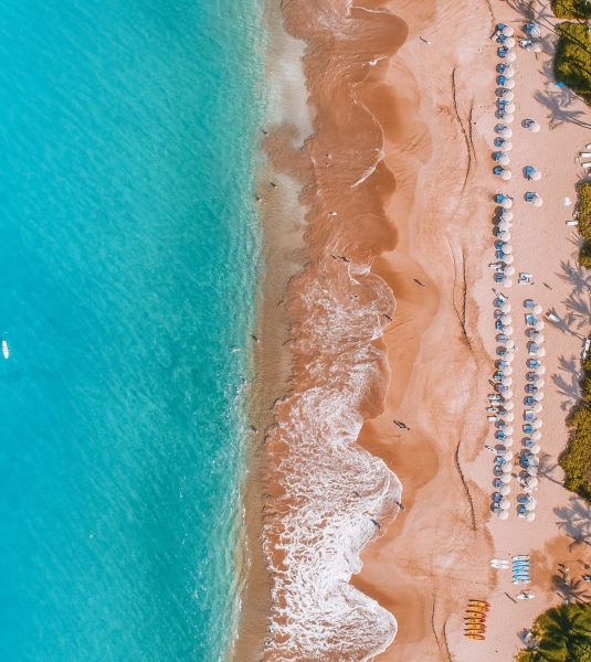 aerial view of Grand Wailea resort and pool with beach and ocean to the left