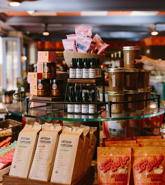 Erewhon products such as Artisan popcorn, Nut Butters, Elixirs and vitamin C packets inside of Loulu within the Grand Wailea