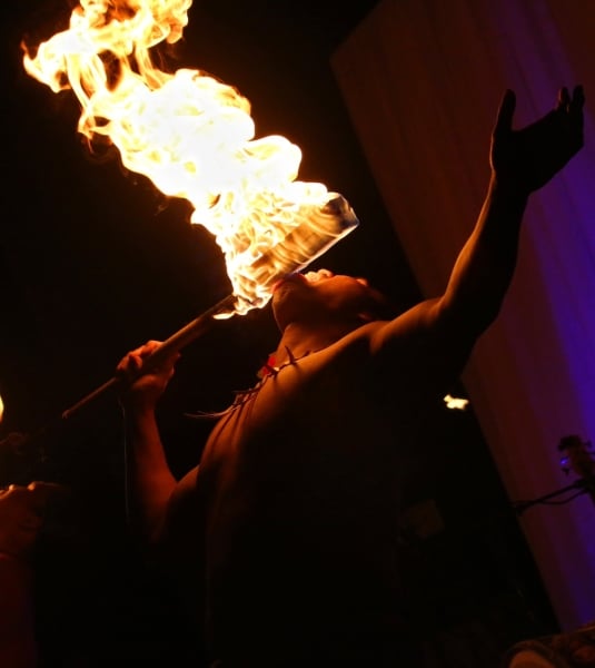A group of fire breathers perform at a Luau