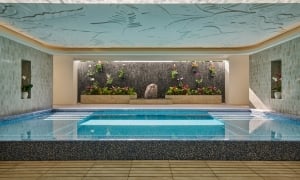 The Kilolani Spa Vitality Pool, with vibrant blue water in a calm, inviting setting.