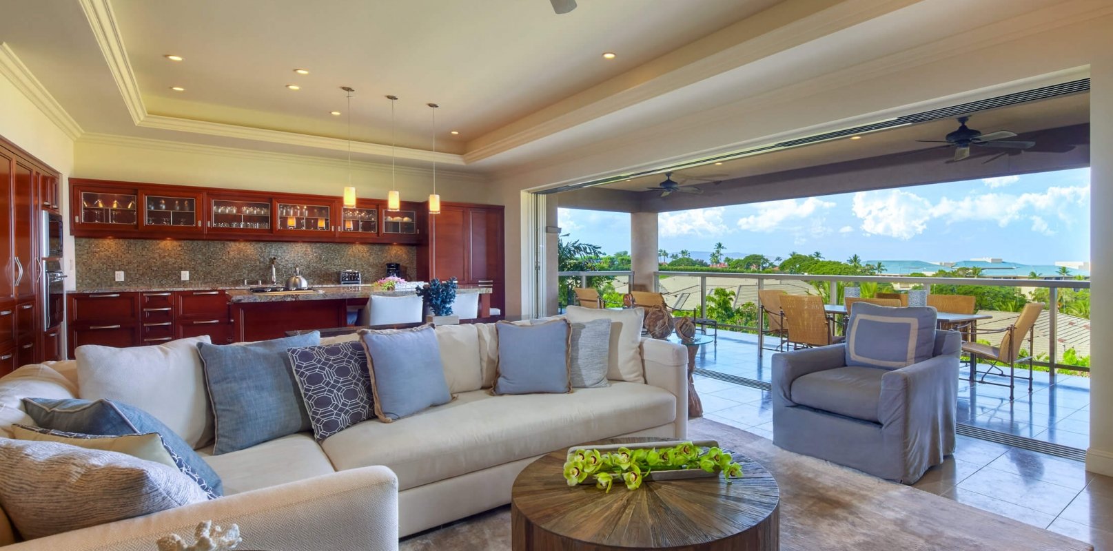 living room seating area in Ho'olei Villas with full wall of windows give view of outside