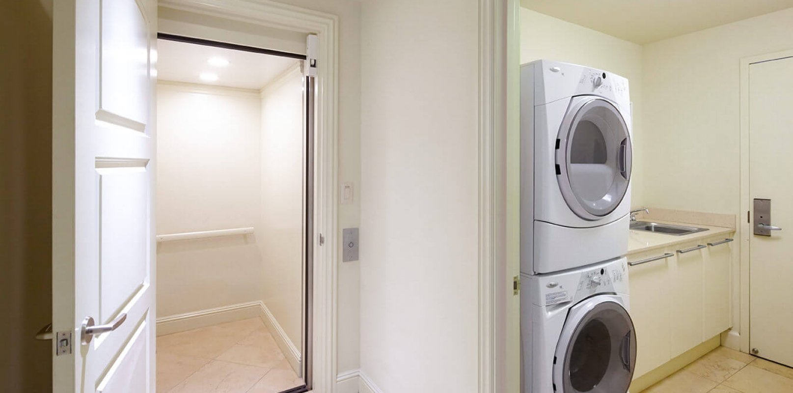 interior view of laundry room with stacked washer and dryer in the Ho'olei Villa