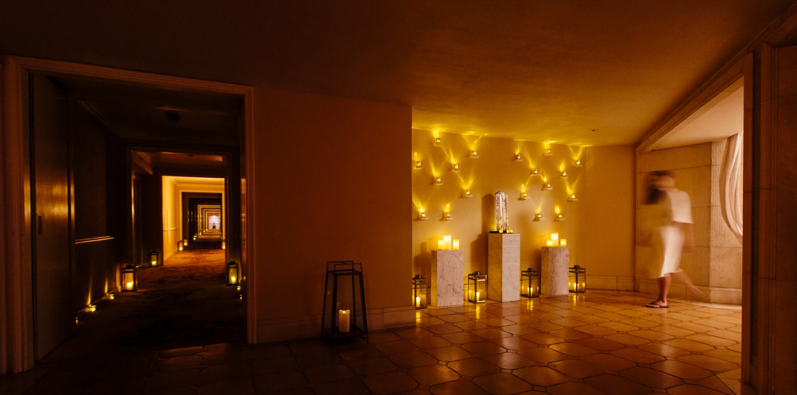 wall of candles flicker inside the spa