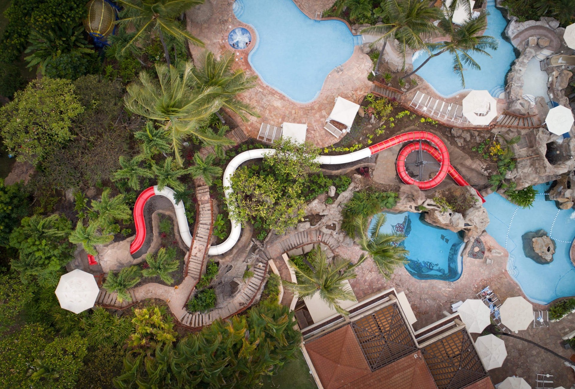 aerial view of the red and white lava tube at Grand Wailea's activity canyon park