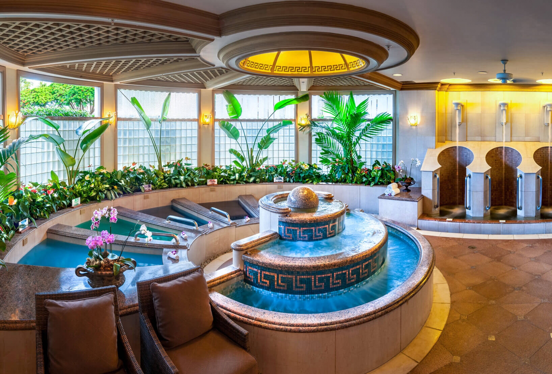 a shell-shaped pool inside the spa grande overlooks thr Grand Wailea resort