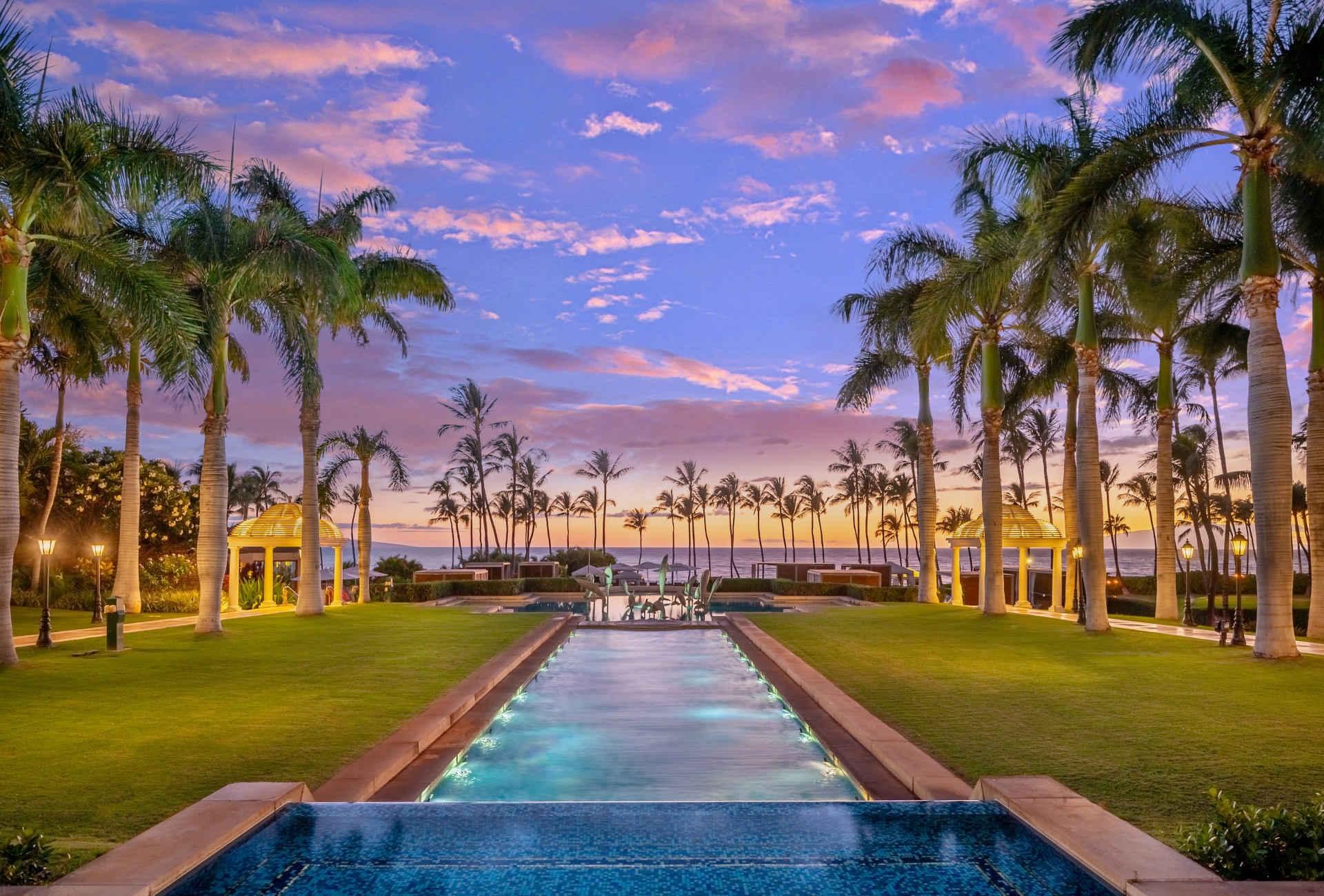 water feature stretches out into the grounds of Grand Wailea resort with lines of palm tress on either side