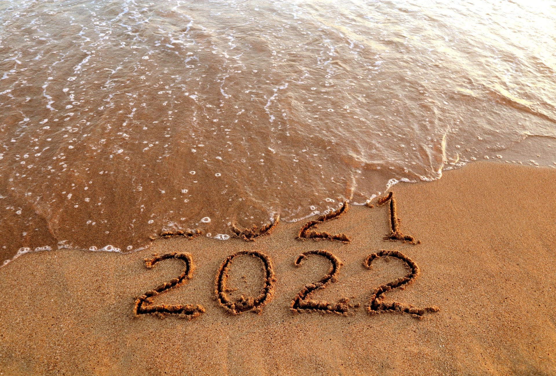 2022 written in beach