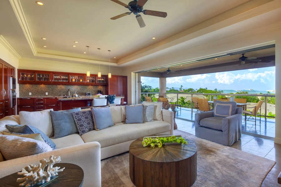 living room seating area in Ho'olei Villas with full wall of windows give view of outside
