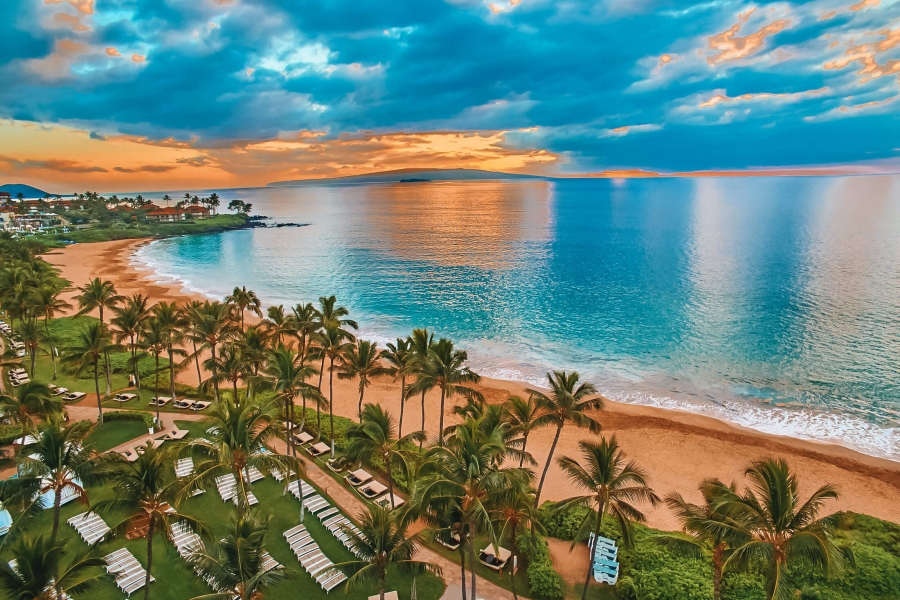 view of the Grand Wailea resort, beach and ocean with a bright blue sky