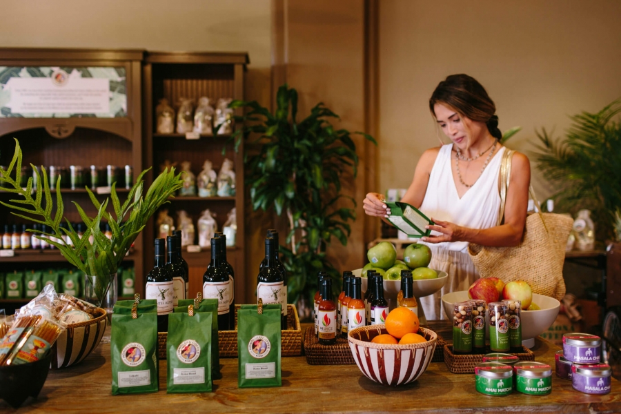 a woman shops inside Cafe Kula storefront
