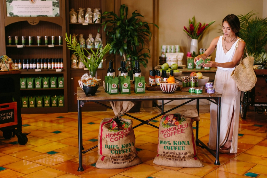 a woman shops inside Cafe Kula storefront 