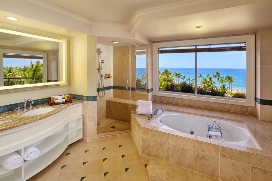 bathroom with panoramic views from tub and sink in the Deluxe Suite