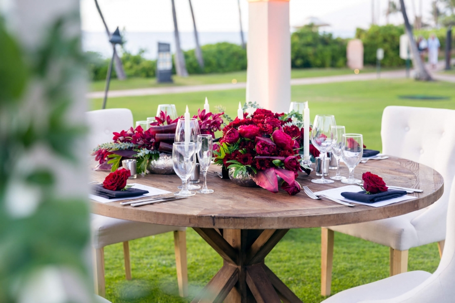 chairs sit around wooden table with floral centerpiece