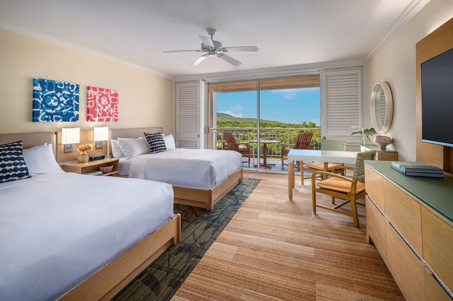 two beds and seating areas in Terrace Queen room with patio doors give view of outside