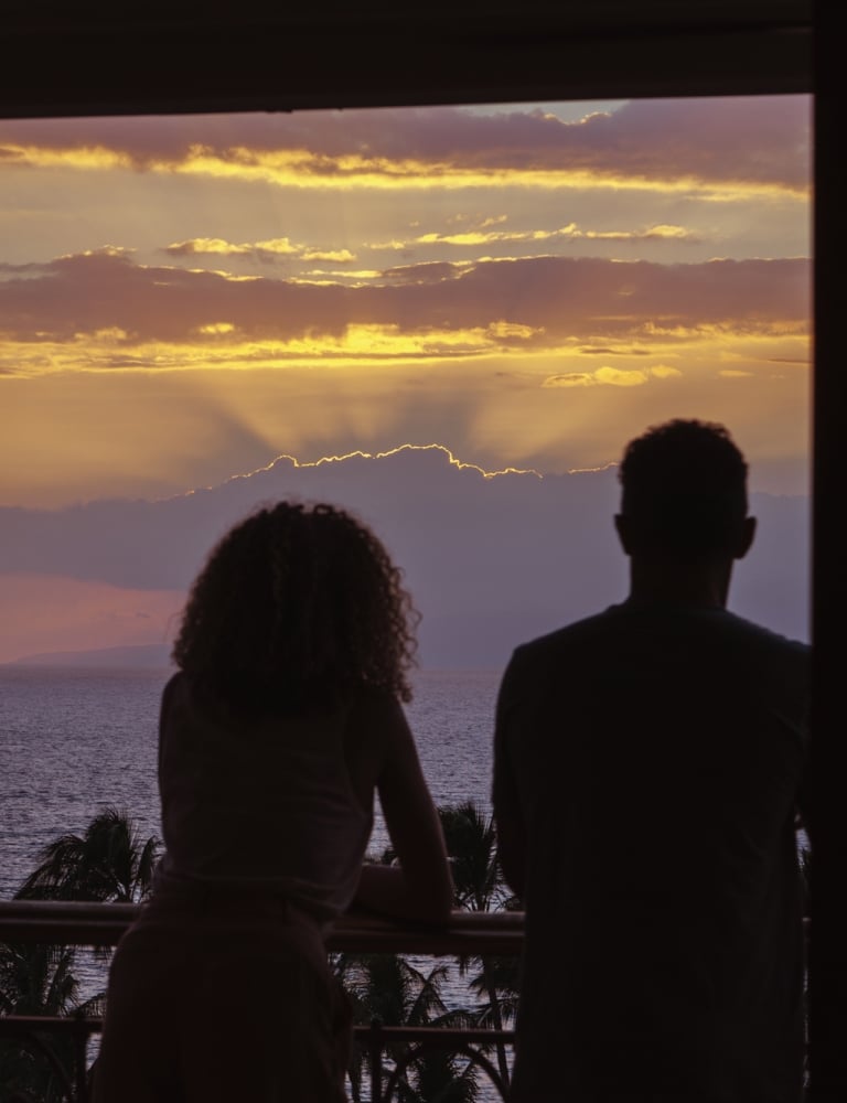 Couple looking into the sunset