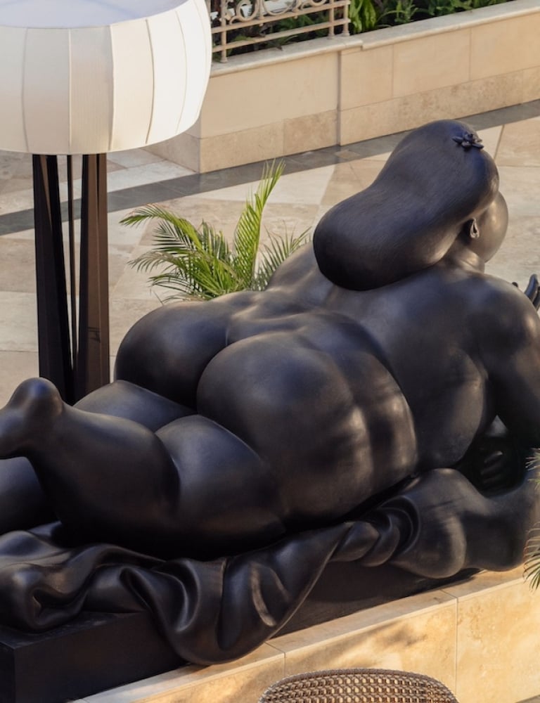 Detail of Botero bronze sculpture depicting a figure lying on their stomach